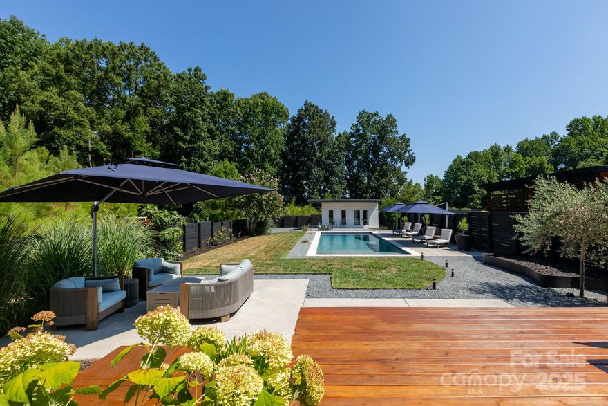 Live on VACATION in this resort-style residence in popular Oakhurst. Enter the custom glass front door to a light-filled gallery w/views to the floating staircase & entertaining areas. The kitchen offers hand-built cabinetry w/spacious island, walk-in pantry & vistas to the backyard. It flows to dining & living rooms, w/slider to the back. There's a large 1st floor bedroom, a stylish bathroom, & laundry. Upstairs, there's a 2nd laundry/flex space, plus 3 more bedrooms, & 2 baths, including the knockout primary suite w/luxurious bath w/designer tile, more site-built cabinets & soaking tub. From the primary, a picture window frames the showplace backyard w/an 18,000 gallon heated saltwater pool, multiple lounging areas w/mounted umbrellas & a pool house. It offers 300 plus square feet of additional living space w/a built-in murphy bed/storage, a bar w/ice maker & drawer refrigerator, & a stunning bath w/shower. Prepare to be impressed at every turn. Welcome home!