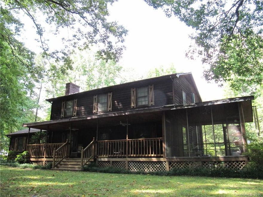 Privacy in park-like setting. House at end of road on 2.35 ac. Rocking chair porch overlooks woods & meandering stream. Porch wraps to screened-in porch opening at back to in-ground pool (new liner 10/2014 per seller). Office/den has 1/2 BA and exit to scrn porch great for pool access. Frpl/built-ins in LR. Sunroom at back. At full price, seller will provide $13,500 at closing to replace 2 existing HP's and new wall HP in encl GAR rec rm (now has window a/c & propane wall unit). Fridge remains.