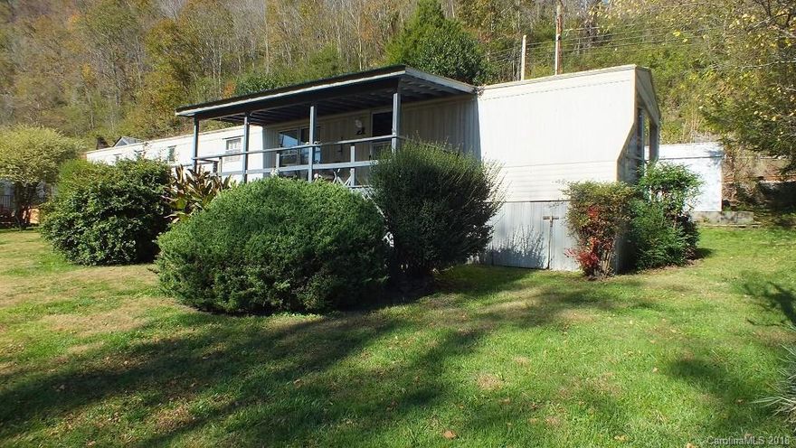 2/2 Mobile Home on .70 acre fronting the French Broad River. Home is to be sold furnished and in "As Is" condition. Sale includes PIN 9716-13-8564