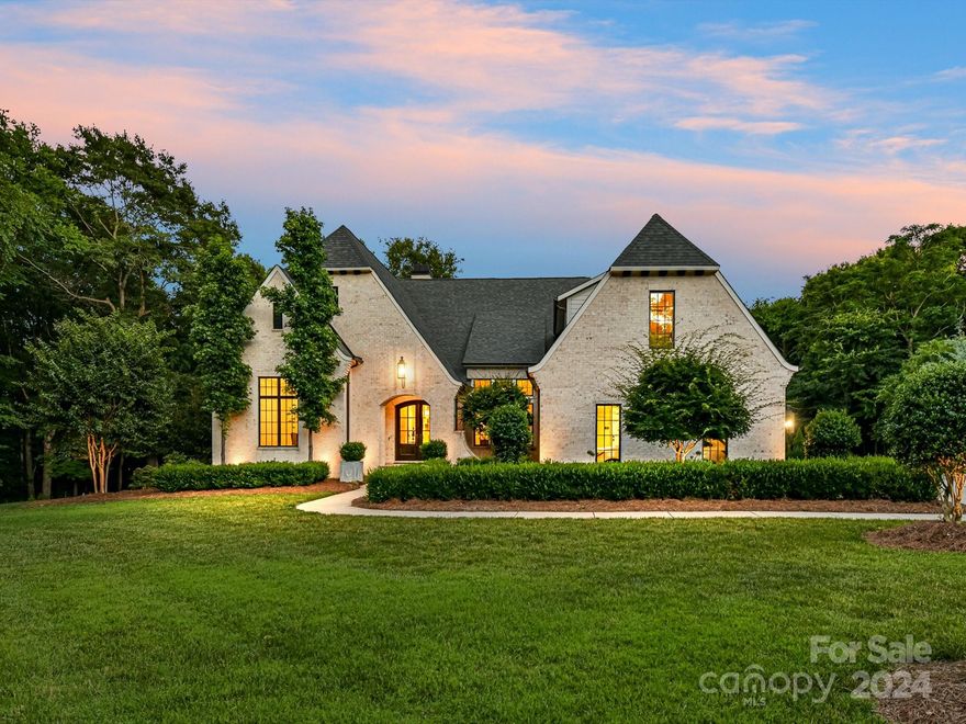 Stunning custom home on 5.3 acres with extensive landscaping and private gated entry. Superior craftsmanship & attention to detail throughout. Restoration Hardware fixtures & lights, custom metalworks glass wine cabinet, custom mantel/wood details, wide plank hardwood floors. Main floor primary w/inlay trimmed ceiling, spa like shower & tub, custom closet. Gourmet kitchen w/large island, quartzite counters, high end appliances, gorgeous custom cabinetry, wine bar. Living room features cathedral beamed ceiling & woodburning FP with gas starter. Two more BRs down, plus office and stunning powder room. Upper level has another bedroom w/full bath, bonus/loft, & plenty of storage. Fully retractable glass doors opens to the oversized covered patio. Beautifully landscaped backyard with customized shed & room to add a pool. Three car garage, w/epoxy floors. Community amenities include clubhouse, pavilion, fitness center, leasable boat slips, pools, tennis courts, playground, & walking trails.