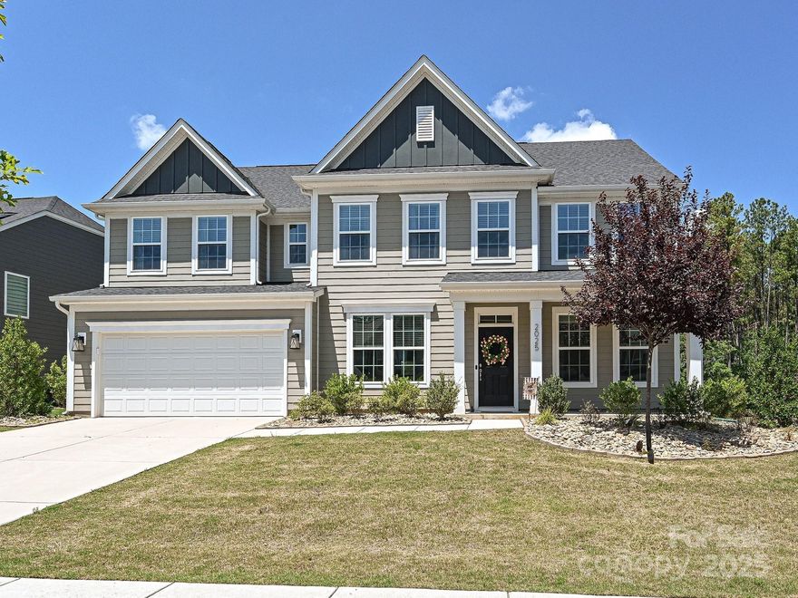 Fantastic home in much sought-after Paddlers Cove. Designed for entertaining, this home features an open concept plan with an extended patio and covered rear porch. Kitchen includes huge island with seating, large walk-in pantry and dual custom drop zones. Stainless appliances including a gas cooktop, quartz counters, oversized subway backsplash, designer pendants, a custom study niche and huge breakfast area provide room for the largest of groups.  The kitchen opens to a bright and cheery family room with custom built-ins, gas fireplace and an abundance of windows. A full guest suite along with a private office and large formal dining room complete this fabulous main level. Home backs to natural area and has common space between neighbors for added privacy.  For the hobbyist, there is a full shop with its own electric panel to complete any project or just use for extra storage.   The upper level features an open loft, huge primary suite and three additional bedrooms and full bath.