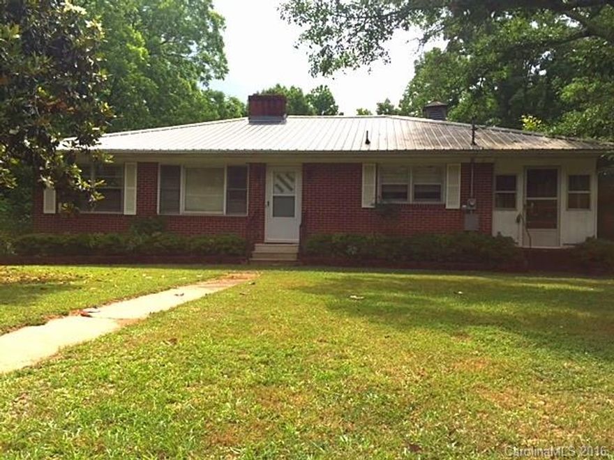 Brick 3 bed and 2 bath home with a nice yard accompanied with huge oak trees and a beautiful magnolia tree. Rooms with carpet have wood floors underneath! This home is ready for your personal touch! Includes a large storage building that you could turn into whatever you want. HWY frontage for home and building. Property is priced well below tax value!