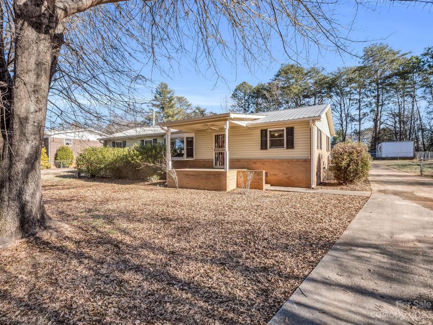 This super cute house is located in an excellent location and has so much to offer. A covered front porch welcomes you into the home, while the fenced backyard provides privacy and security. There are also three outbuildings that can be used for tinkering or storage. Inside the house, you will find three bedrooms and two full baths. The living room is spacious and opens up to a highly functional kitchen with plenty of counter and cabinet space. The finished area, which was once a garage, provides additional flex space that could be used for dining, crafting, a recreation room, a lounge area, or whatever else you desire. One of the rooms would be perfect for an office. The primary bathroom features a tiled walk-in shower, while the hall bathroom boasts a large soaking tub. Sited on just under a half acre, there is plenty of space for outdoor entertaining and enjoyment. Make a point to check this one out and have it become yours!!