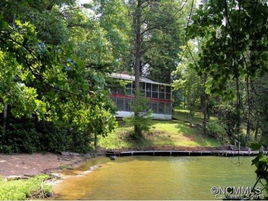 Once in a lifetime opportunity to own nearly 14 acres with 1200+ feet of lake frontage. House is a fixer-upper. Has boathouse. Fantastic mountain views.  Sub dividable.
