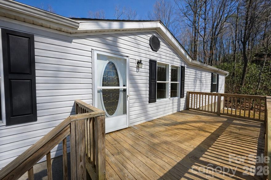 Located between Mills River and Etowah, this well-maintained 2BR/2BA manufactured home offers peaceful countryside living with easy access to shopping, dining, and local favorites like Sierra Nevada Brewing Co., Bold Rock Cidery, and Burning Blush Brewery. The home features a bright, open layout ideal for everyday living and entertaining, along with a versatile bonus room perfect for a home office or flex space. The kitchen has been lightly renovated for a refreshed feel, brand-new carpet has been installed in all bedrooms, and major updates include a new roof in 2023 and a new heat pump in 2022, offering added comfort and peace of mind. Schedule your showing today!
