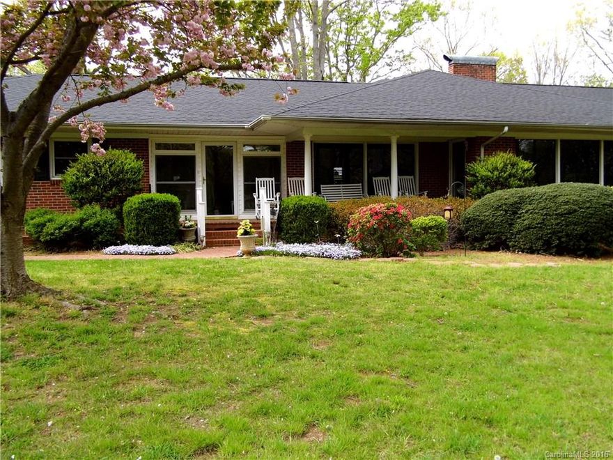 Wonderful 3 bed/2bath, high quality, well maintained brick ranch on 2.9 wooded acres. Custom built-in features, Hardwoods throughout, updates to kitchen with an open floor plan. Enjoy the natural setting, close to town, but without additional property taxes. Lovely Sunroom, 2 fireplaces, large bedrooms & a cellar! Sit on the porch & enjoy the lovely landscaped yard, mature shrubs & trees with a rustic building ready for all your projects, or the Man Cave. You will fall in love with this one.