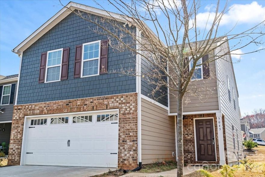 Tucked inside the Abrial Ridge community, this 2023-built home offers a bright and inviting open floorplan with 4 bedrooms and 2.5 baths across 2,174 square feet. The main level features a spacious living area centered around a gas-vented fireplace and flows seamlessly into a modern kitchen with a large granite island, stainless steel appliances, and a pantry. Natural light fills the space, highlighting the clean finishes and easy access to the backyard with a wide, open view. Upstairs, all four bedrooms are generously sized, including a comfortable primary suite with an ensuite bath, double vanities, and a large walk-in closet. The upper-level laundry adds everyday convenience, and the home also includes a two-car front-entry garage. Located just minutes from downtown York, Lake Wylie, the York Recreation Complex, and Highway 49 for quick access into Rock Hill and Charlotte, this home blends modern comfort with a prime York location.