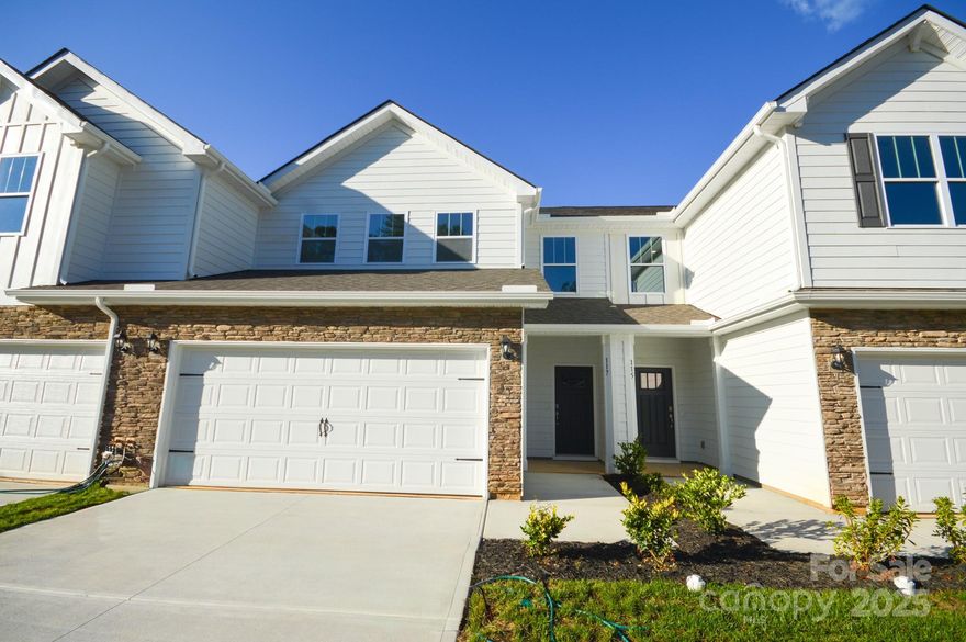 A new townhome community North of Asheville. These low maintenance townhomes offer 2 car garages and are close to everything Asheville has to offer! This floor plan features 4 bedrooms, 2.5 bathrooms and at over 2200 square feet, there is room for everything you need. The primary bedroom is conveniently located on the first floor, with the other three bedrooms and a loft space upstairs. The open floor plan seamlessly blends the living room, dining room and kitchen areas for an open, bright feeling.