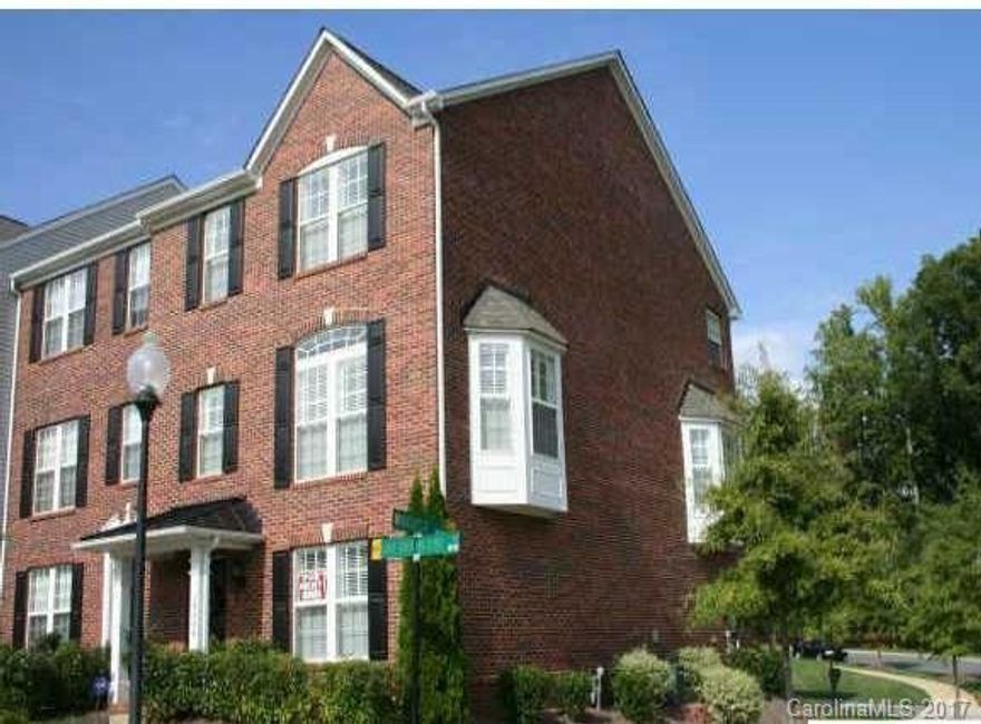 Beautiful "End Unit" overlooking greenway.  All the bells & whistles.  Hardwood floors thru-out entire home. Plantation shutters thru-out.  Large gourmet kitchen with Granite countertops, stainless steel appliances, gas cooktop, breakfast bar, pantry.  Tile in all baths. Master has whirlpool tub & separate shower. Tray ceilings &  extensive moldings thru-out. Built in speakers thru-out.  Security system.  Lower level for office, media or guest space.  Double French doors to deck. Neutral Colors.
