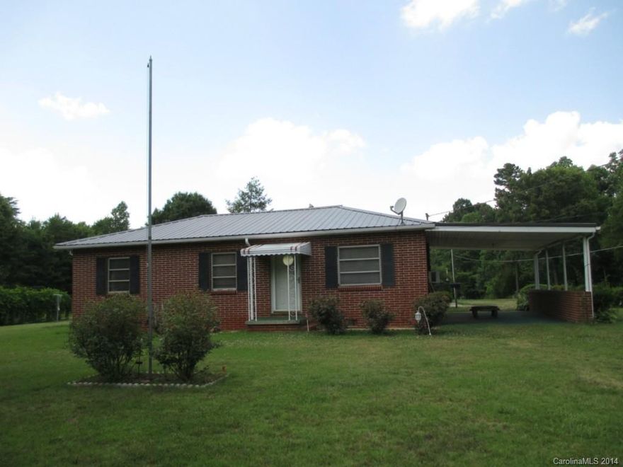 Brick home on huge private property. A large covered patio provides outdoor living space. While the formal dinning room and eat-in kitchen allows for year round indoor entertaining. Cozy knotty pine living room plus a den gives ample room for gatherings. There are hardwood floors in bedroom and under the current wall to wall carpeting in the living room. Multiple out buildings for storage and a workshop with electric and wood stove offer scope for the imagination.