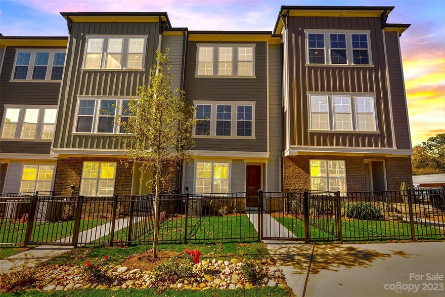 Ready for MOVE-IN! The Callum, a 3 story, home in Central Living at Summey with a fenced in front yard.  This Callum is FULL of windows and is super Light & Bright, very spacious and welcoming. Second floor is made for entertaining with 10' soaring ceilings, open and inviting, featuring a large kitchen island perfect for gathering while creating meals and memories in the heart of this home. The soaring ceiling in the Owner's Retreat, comfortable sitting area and spacious walk in closet make the Owner's Retreat a relaxing and beautiful place to recharge your batteries each night. This home features a side by side two car garage as well. Timeless elegance and superior craftsmanship, not to mention desirable location, make this a perfect place to call home.