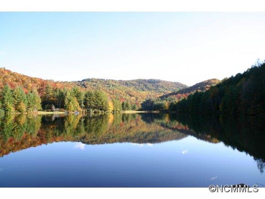 Magnificent property with private 25 acre spring fed lake, dock, pavilion, sandy beach, picnic area, mountain views. This property has it all! Would make a great equestrian retreat. A quaint cabin is tucked into the mountainside and overlooks the lake. Great room, lofted ceilings, master on main w/lofted guest BR. Two manufactured homes serve as guest accommodations. The possibilities are endless!  A perfect family retreat.