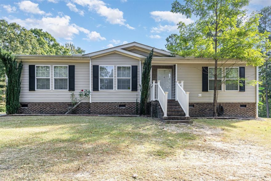 This Chester County Charmer is perfect for those looking for acreage but also a simple commute to work, school and activities. Delivering privacy, convenience and nearly 3 Acres - this rural, serene home is waiting for its new owner. With a prime location, only 10 minutes from I-77 - you can easily travel to Columbia, Charlotte, or Rock Hill.  This is a manufactured home with HUD Compliant Foundation and Engineering Certification readily available. Brand New Deck. Well pump, water lines, crawl space updated in 2020. Recently vacated and ready to sell!The interior of the home is optimally designed with the primary suite secluded from the other bedrooms providing an excellent flow. A centerpiece fireplace anchors the openness of the living and dining area. Explore the opportunities and possibilities of owning rural residential acreage between two major cities in the Carolinas.