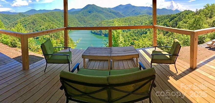 Investment Opportunity at an 8% Cap Rate! What's for sale: 3 freestanding, fully furnished Short Term Vacation Rental Homes that have exclusive panoramic views of Fontana Lake and the Great Smoky Mountains National Park, located in Bryson City, NC. Strong 9 year rental history offers an established investment opportunity.

Come enjoy a peaceful sanctuary surrounded by untouched Nantahala National Forest. Delight in being remote enough to be immersed in nature, while having quick access, just 12 minutes to downtown, restaurants, and shopping. Lake access is just a 5 minute drive to a boat ramp and marina. This property is an hour west of Asheville, NC, 2 hours from Knoxville, TN, 3 hours north of Atlanta, GA, and only 4.5 hours to the coast of SC.

Investment Summary

Stable long term investment opportunity with consistent returns

9 Year Established STR History

70% Occupancy Rate (w 3 night minimum and no pets)

2,072 Total sq ft on 2.1 Acres

NOI - $159,217