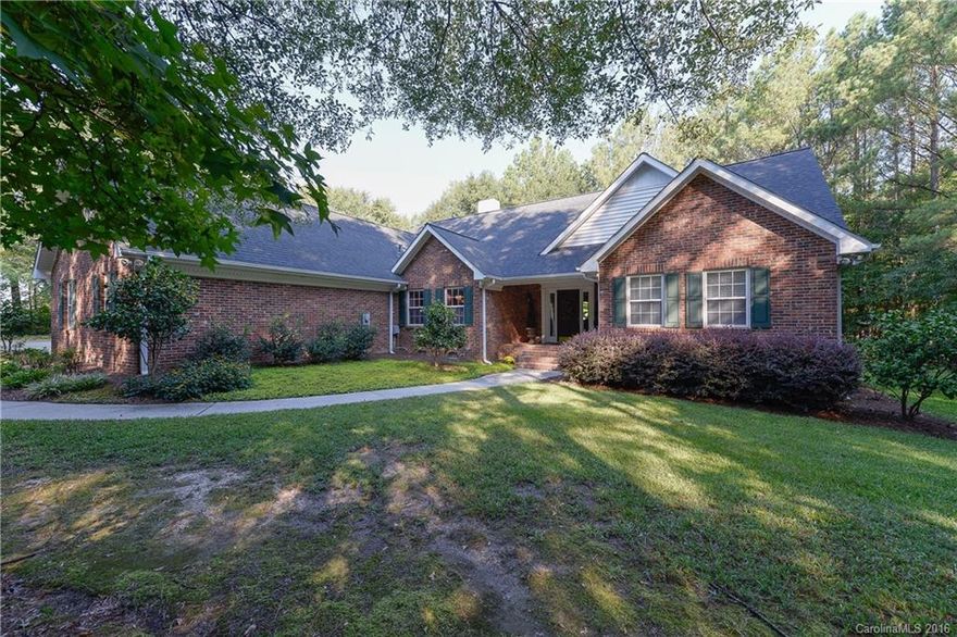 Beautiful custom brick home in an amazing setting nestled in the trees. Large kitchen with island, hardwood flooring, large master down with sitting area. Modern baths with vessel sinks. Everything is upgraded. Relax on the large screened porch overlooking the private back yard. Buford schools.