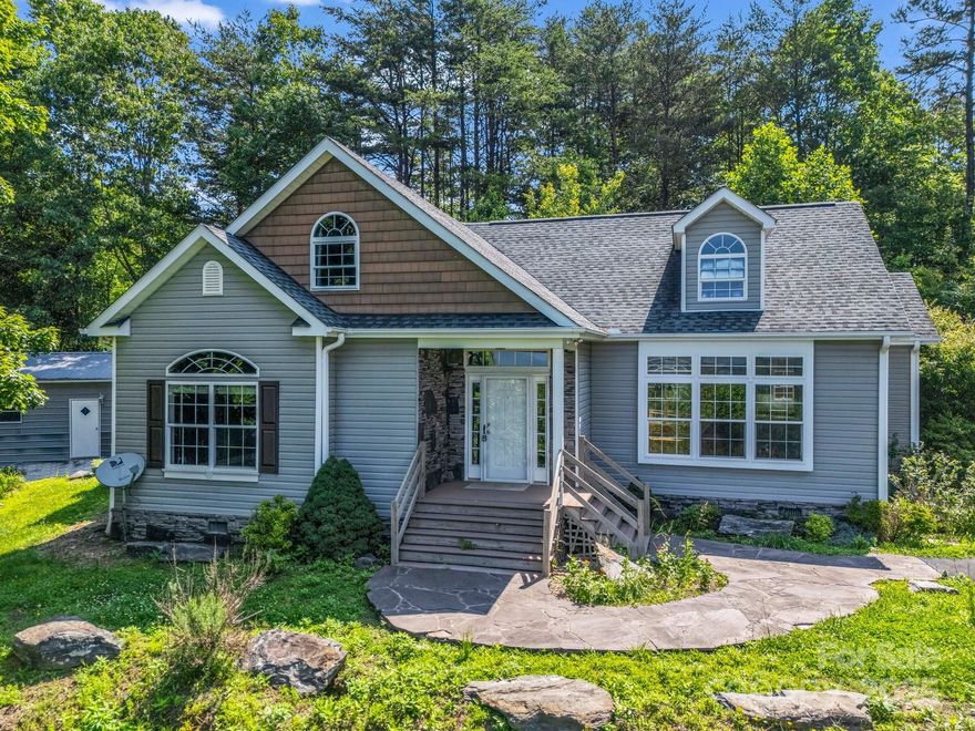 Been looking for breathtaking mountain views close to a lake? Look no further! This home is a perfect escape from the daily grind of busy life & just a 20-minute drive to Lake James. Septic system designed for 2 bedrooms, though current owners utilized extra spacious upstairs flex rooms as additional bedrooms/play space. Main floor has 9' ceilings & large windows overlooking year-round mountain views. Main level open floor concept. Primary ensuite has double vanities & walk-in closet. Office, 2nd bedroom, full bath, laundry also on main. Kitchen boasts stainless steel appliances, new farm sink & quartz countertops, freshly painted cabinets. New well installed in 2024. Property has metal detached garage/workshop with electricity. While this is a private mountaintop home, location is convenient! Less than 10 minutes to Lowes, Ingles, dining, downtown shopping, interstate access. About 40 minutes to the Asheville Regional Airport.