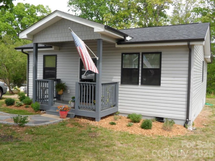 Lovely, totally renovated home-from top to bottom-with an addition on rear. This home features an open concept living area, great for entertaining, along with 3 bedrooms and 2 full baths. Personalized add-ons by Seller include custom shades in kitchen/dining area, stunning light fixtures, walk-in shower, full view storm doors, firepit and a 10x20 storage building. Relax with lemonade on the patio or enjoy S'mores by the backyard firepit.  Located on a quiet street and is close to town. Asheville, Charlotte and the North Carolina High Country are all just about one hour away.