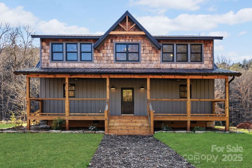 Riverfront New Construction: Mountain Luxury on the Water! Welcome to your dream home nestled along the tranquil banks of the Tuckasegee River. Step inside this open-concept home to find high-end finishes throughout, including LVP floors, custom cabinetry, and an expansive covered outdoor living space. The kitchen has ample space with quartz countertops, stainless steel appliances, and a farmhouse sink in the island so you can stay connected to family & friends. The main living area features shiplap walls & ceilings and a cozy gas fireplace, leading to the covered outdoor deck where you can enjoy your morning coffee or evening sunsets while taking in the peaceful sounds of the river. The expansive backyard has direct gentle access to the river, ideal for fishing, kayaking, or simply relaxing by the water. Located just minutes from WCU, this home offers the ultimate convenient seclusion. *Home is not in the Special Flood Hazard Area per LOMR-f document on FEMA website. No flood damage from Helene.