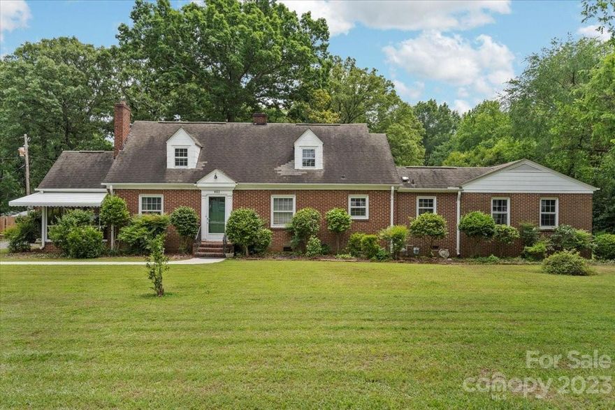 Gorgeous 2 story brick home that has been perfectly preserved through the years! It’s a treasure trove of times past with the potential to be updated with all the modern feels or move right in and enjoy the nostalgia that surrounds you!  You will fall in love with the original hardwoods, door knobs and chandeliers! This 4 bedroom/2 bath home features a formal living room with a fireplace formal dining room, roomy eat in kitchen, 3 bedrooms and full bath on the main floor and a bedroom, full bath, office and loft area upstairs!  Enjoy our sweet southern seasons from the screen porch or relax under the canopy of the majestic hardwoods! Nestled on a large corner lot close to historic downtown York, SC! Hurry home to 802 N Congress Street!