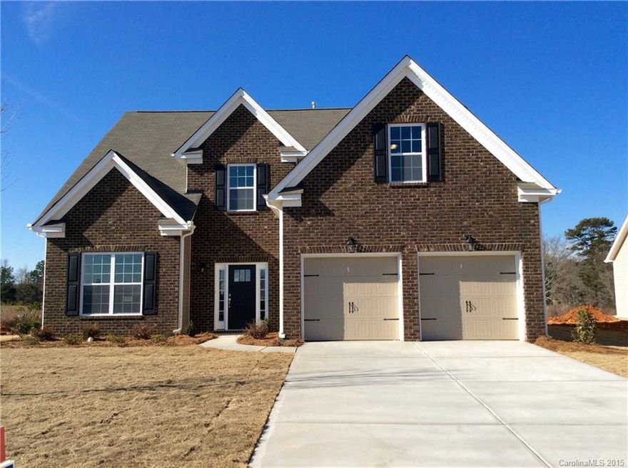 Master down with 2 bedrooms and a bonus upstairs. Beautiful brick front exterior. Spacious kitchen open to the family room. Spectacular 2 story family room with incredible double bay windows! Beautiful hardwoods in Foyer, dinning rm., family rm., kitchen & breakfast. Tile in all bathrooms & laundry, Fireplace, Granite Countertops and stainless appliances. Corner homesite with pavers and sitting wall.