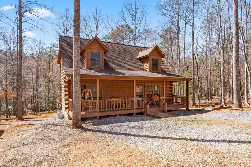 Private custom log cabin retreat with hot tub, move-in ready condition, single-owner history, and short-term rental potential in the sought-after gated community of Hearthstone Ridge.

Step into this exceptionally cared-for mountain retreat nestled on 1.81 acres of wooded tranquility, where indoor comfort blends seamlessly with outdoor living. Enjoy morning coffee from the covered front porch as sunlight filters through the trees, or unwind on the upper-level deck in your private hot tub after a day in the mountains.

Lovingly maintained by its original owner and used only as a personal vacation getaway, this home has never been part of a rental program, offering buyers a rare opportunity to own a cabin with limited wear and pride of ownership throughout.

The main level features a cozy living room with fireplace, spacious kitchen with ample dining space and breakfast bar, plus two bedrooms and a full bath. Upstairs, the primary suite offers an ensuite bath and loft space ideal for a home office, reading nook, or additional guest accommodations.

Located just minutes from Rutherfordton’s charming Main Street with local dining, breweries, and shops, and within easy reach of Asheville and surrounding mountain destinations, this property offers the perfect balance of seclusion and convenience.

Select furnishings available for purchase outside of contract, offering a potential turnkey setup for buyers seeking a seamless transition.

Whether you're searching for a full-time residence, weekend escape, or future investment opportunity, this cabin delivers comfort, versatility, and timeless mountain appeal.