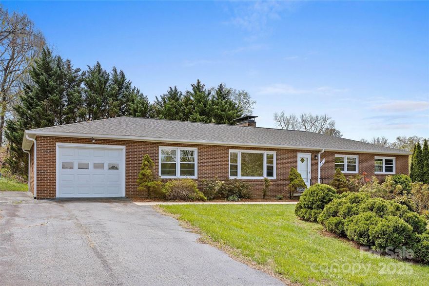 Backups Requested! Total remodel in 2024 - Like new!
With brand new stainless appliances and leathered granite. 
New heat pump and updated electrical. 
Beautiful hardwood floors, modern bathrooms,
large lot and
tons of storage! Epoxy finish on upper garage floor
and 3 spaces for cars in two garages!
Built-in bookshelves in den, brick woodburning fp (seller never used - no rep)
soaking tub with shower and 
beautiful fixtures throughout - Truly a stunning home and close to all that make N. AVL a great place to live! Near Beaver Lake, Pizzeria 828, Asheville Community Yoga and more! Call today for your private showing!