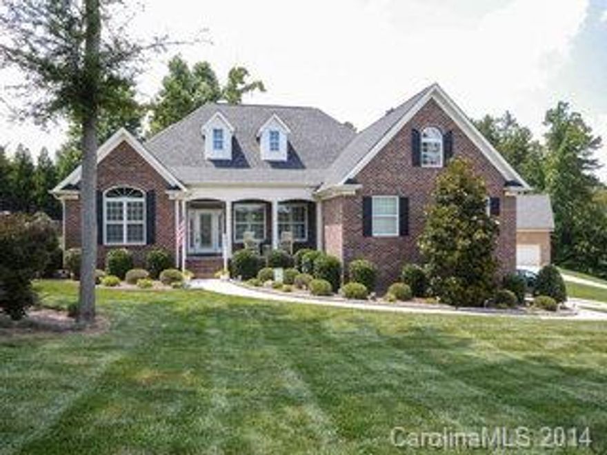 Beautiful custom built home w/4 car garage! You'll love this home from the moment you arrive.Curb appeal,lush landscape,wide steps & a welcoming front porch greet you.Grand entrance,high ceilings,HW floors,huge DR for entertaining & great flow in this open plan.French doors to office w/custom built-ins.Plantation shutters,FP,granite counter tops,SS appliances,private fenced backyard & great storage are just some of the benefits!2 big screen TVs in LR & BR remain.Below appraised value of $340,000