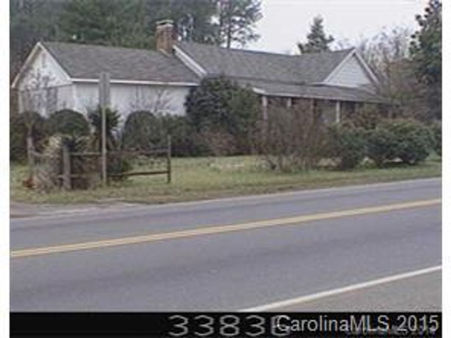 Neighborhood Business property for sale at least $100,000 under tax value, downtown Denver.  Neighborhood business zoning could be used for: Daycare center, church, business office park and residental.  SELLING PROPERTY AS IS.  NO VALUE FOR THE HOUSE OR SHED.  MAIN PART OF THE HOUSE BUILT IN 1890. Value for land only, must call Listing Agent to view buildings.  156' road frontage.  More than a half acre lot with county water and sewer and other utilities.