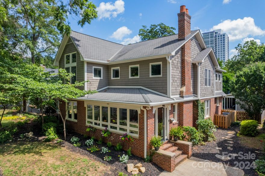 A MUST SEE! This charming home is nestled in Dilworth's historic neighborhood, offers a warm, inviting atmosphere. Spend quality time on the enclosed front porch with friends and family. Step inside to discover a light-filled living room featuring gas fireplace that flows into the dining room, which boasts oversized windows. The bright kitchen has been updated and features 6-burner Wolf cooktop, pantry, large island, and quartz countertops. Main floor includes a primary suite with spacious customized walk-in closet, tub, and double vanity. Upstairs, a generously sized family room awaits with built-in bookshelves and window seat. Three spacious guest rooms all feature large walk-in closets, custom storage systems. Both bathrooms on the second floor have been updated. Outside, the private landscaped backyard and patio provide a serene retreat in this urban setting. Located just steps away from Dilworth Elementary, Latta Park, charming neighborhood shops, restaurants, and South End.