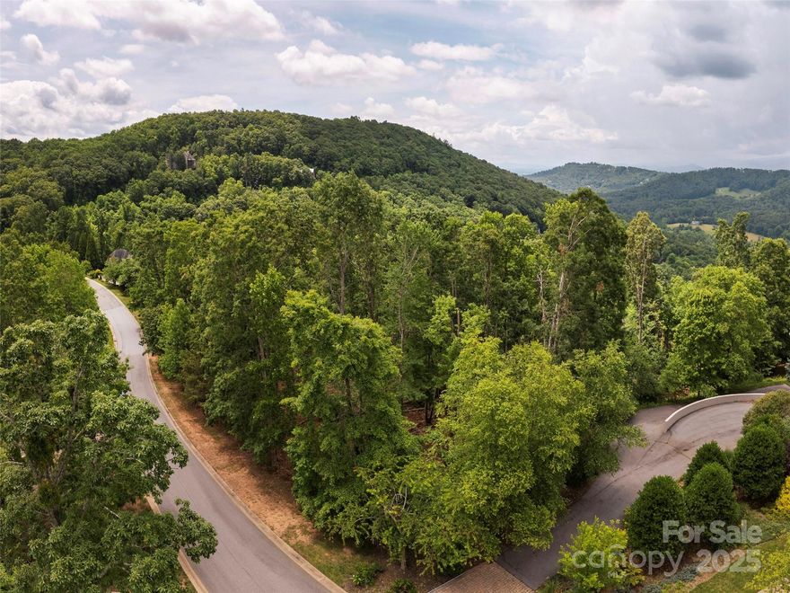 Looking for a big view lot??? If so, we have the lot for you. Build your dream home in the desirable gated community of Poplar Ridge on one of the best view lots remaining! Located within minutes of several grocery stores, shopping centers and dining options, this location and opportunity are hard to beat. Poplar Ridge is known for its majestic mountain views and large private lots with lush vegetation. Enjoy summer evenings with the kids at the community playground or picnics at the neighborhood overlook. Asheville Regional airport is located within 25 minutes, making travel convenient. Make this opportunity yours! Seller is a licensed SC real estate broker.
