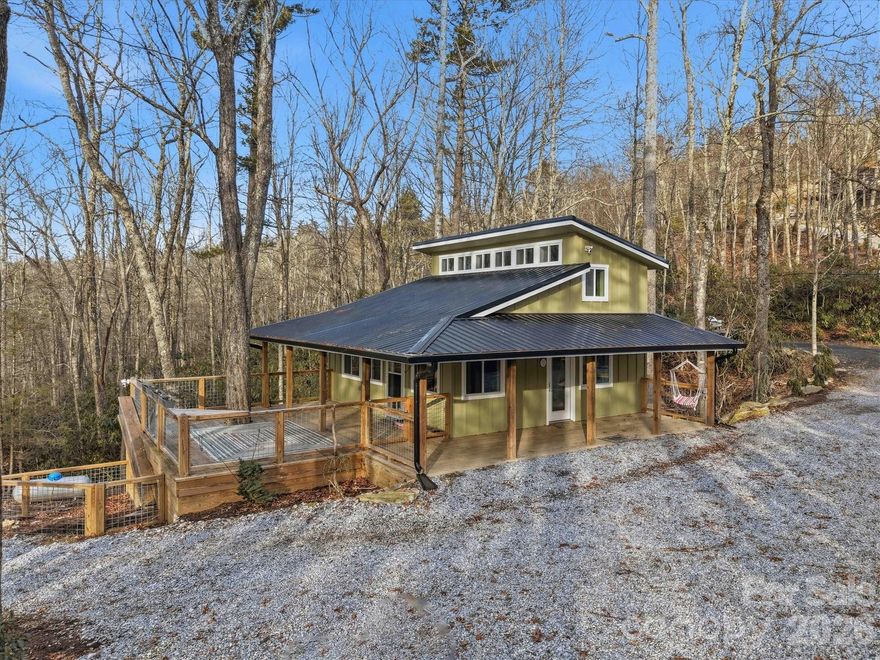 Mountain Adventurer’s Dream Meets Cozy Modern Retreat! Completed in 2023, this mountain retreat blends modern design with a setting made for outdoor enthusiasts. Located just one mile from the Blue Ridge Parkway, the property is steps to the Linville Gorge Wilderness Area, renowned for its exceptional hiking, while mountain bike trails, trout fishing and rafting opportunities are conveniently nearby.

The main floor features an open-concept layout with a modern kitchen, a utility room, and a full bathroom, along with ample space for both a comfortable living area and sleeping quarters. Clean lines, thoughtful finishes, and efficient design create a warm, inviting interior that feels both functional and relaxing.

Upstairs, a loft accessed by steps provides space for two queen-sized beds or one king, and includes a pre-planned area for a second bathroom, allowing for easy future installation. Plumbing is roughed in and extra flooring stored inside wall matches existing loft flooring. 

The exterior is designed for durability and adventure, featuring Hardie board siding with board-and-batten detailing, a propane-powered 10kw backup generator, and multiple outdoor living areas. A covered porch and open deck incorporate mature trees directly into the structure, offering a truly immersive mountain experience. A climbing wall along the porch and a standalone treehouse designed for climbing or rappelling add rare and exciting character to the property.

Practical amenities support both everyday living and future expansion, including:

Enclosed storage beneath the home, large enough for a tractor, ATV, and workshop; 

4-bedroom septic system and a second electrical panel, already in place for future growth;

Three RV power hookups, including one full hookup to septic;

Small fenced dog lot;

Private gated access, shared with just one full-time neighbor and several part-time residents.

Thoughtfully designed and exceptionally located, this property offers a rare combination of privacy, modern comfort, and direct access to some of the region’s best outdoor recreation—a true mountain retreat built to grow with your lifestyle.

No drive-bys, please. Property is located at the end of a private gravel road behind a locked gate.

Ask your agent for copy of pre-listing home inspection.