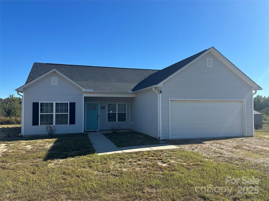 Located only 1.3 miles from White Plains Golf Club and approximately 2.5 miles from downtown Pageland, this 2021 year built home has been very well maintained and is move in ready! The open kitchen, overlooking the great room, features granite counters, stainless steel appliances and plenty of cabinets, that leads to the attachd two car gararge. The split floor plan affords plenty of privacy to the spacious primary bedroom/ensuite bathroom with dual vanity, deep soaking tub, separate ceramic tiled walk in shower and walk in closet. The other two bedrooms share easy access to the full hall bathroom with ceramic tiled surround. Other features include vinyl plank flooring throughout, recessed lights, 9 ft. ceilings, crown molding, ceiling fans and more!