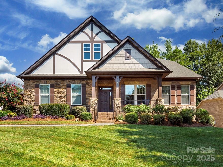 Meticulously maintained full brick home resides in the sought-after community of Barber Rock. This stunning 5-bedroom, 3-bath home provides a spacious primary suite and 2 additional bedrooms on the main floor with 2 large bedrooms upstairs.  The home boasts solid hardwood floors throughout, custom moldings & 2 amazing bay windows. The kitchen is equipped with a Sub-Zero refrigerator to make entertaining fun & easy. The laundry room finishes include custom cabinetry, an undermount sink, a granite countertop and updated tile flooring.  The primary bedroom closet and kitchen pantry have  custom closet systems. Outside features include landscape lighting and irrigation system. The home has a 2-car garage and with an additional carriage garage – both have been updated with new door systems. The main floor includes a 4-ton HVAC system. Barber Rock amenities include an outdoor pool, playground, & recreation areas. Conveniently located near Fort Mill, Indian Land, and Ballantyne