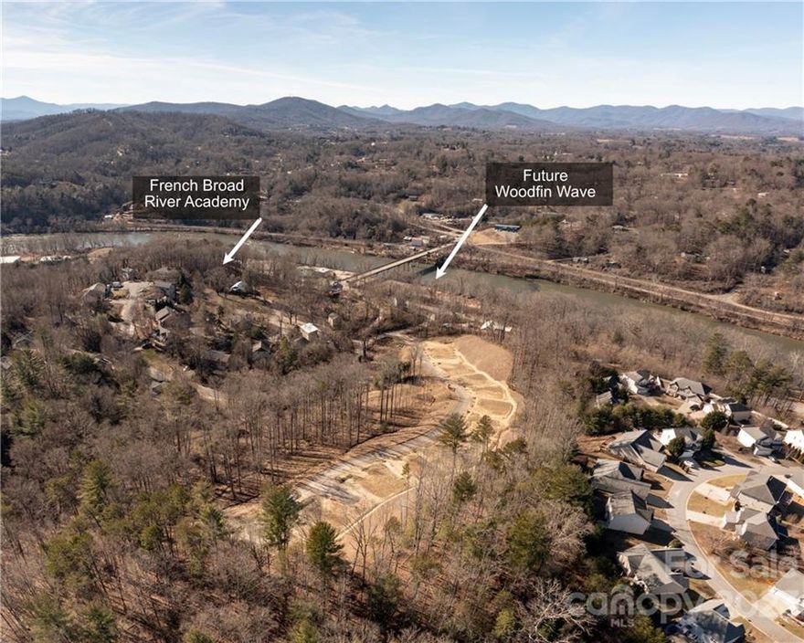 20 Ready to Build Lots in Woodfin.  This is a limited time offering before developer decides to build. This project is fully permitted and ready to start construction. 13 Slab on grade lots and 7 foundation lots. All infrastructure is in place. City Water , Public Sewer, Natural Gas, Underground Electric, Storm Water, and Cable.  Paved road and drainage built to proper specs for city to maintain in the future. Conveniently located Woodfin, just 6 minutes to Downtown Asheville. Right off the banks of the French Broad River and directly across from the future "Woodfin Wave"  coming 2025. Also across from French Broad River Academy. This is the perfect opportunity to help meet the high demand for housing inventory in the area. No HOA or covenants in place. New owner to set their own parameters.  Potential owner financing for the right buyer.