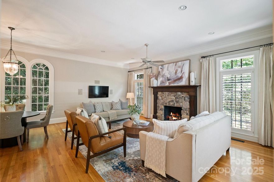 Welcome to this breathtaking 5,700 sq ft custom estate on 1.5 acres near Quail Hollow Golf Course. Designed for refined living and grand entertaining, this five-bedroom, 4.5-bath home spans three finished levels with open-concept layouts and serene backyard views from expansive porches. The main level features a chef’s kitchen with premium appliances, elegant living and dining spaces, rich hardwood floors, and a luxurious primary suite with spa bath and outdoor access. Upstairs offers three spacious bedrooms with two full bathrooms, while the lower level boasts a guest suite, recreation area, billiards room, wet bar, and access to the outdoor retreat. Enjoy resort-style amenities including an outdoor kitchen with Big Green Egg, a fire pit, and a large hot tub. This exceptional home blends comfort, sophistication, and premier lifestyle in one of Charlotte’s most sought-after neighborhoods.