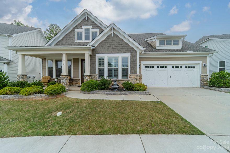 BETTER THAN NEW! Why? Let me tell you! This home rests upon one of the few lots that back to a wall of trees & seller added TONS of upgrades during building & AFTER! SHOW STOPPING outdoor area w/large paver patio w/matching stone planters, walls & additional plantings & trees. Separate area for gas grill & fenced yard w/3 access gates. Architectural molding, beautiful, wide plank engineered wood flooring through-out majority of home. STUNNING Gourmet Kitchen w/white cabinetry on perimeter & massive 9x6 mocha colored island w/high end granite ctop, SS appliances, gas cooktop, wall oven & microwave. Kitchen opens to dining area (both w/upgraded lighting) & Great Room featuring a gas fireplace & Plantation shutters. Primary on Main w/luxurious bath, custom closet & added side door leading to patio. 2 additional bedrooms & office. Upstairs presents a large loft, walk out balcony, walk in storage, bed & bath! Garage w/4 foot bump out & sealed floor! Meticulously maintained & MOVE IN READY!