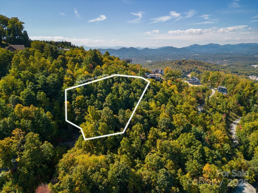 Welcome to Leisure Mountain - a high-elevation building lot near the top of the mountain with a cleared level building site. Mature trees, rock outcroppings and long-range views overlooking Weaverville and the Reems Creek Valley. Just minutes to town and everything on Merrimon Avenue, and in addition just minutes to Quaint & Historic Downtown Weaverville! City water, city sewer, and underground electricity make this an ideal option for your dream new build! Level driveway and partially cleared level building spot on top of old road bed. Come visit today!