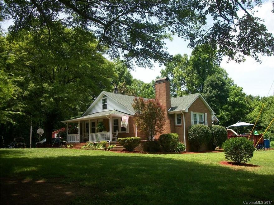 Country Home secluded in woods and pastures very private, possible use for horses, cows etc. Front and Back porch, Farm style kitchen, lots of trees surrounding home, sits on corner of acreage.