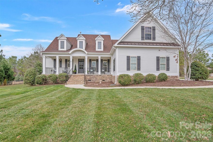 Nestled on just over an acre in the highly sought-after Catawba Shores Estates in Rock Hill, this beautiful 4 bedroom, 4 bathroom home offers privacy, thoughtful design, and exceptional indoor and outdoor living.

The open floor plan features a stunning two-story living room with custom built-ins and a gas fireplace, flowing seamlessly into a spacious dining room ideal for entertaining. The eat-in kitchen is designed for both function and gathering, featuring stainless steel appliances, gas cooktop, double ovens, and a charming keeping room with a second gas fireplace.

The main-level primary suite offers a peaceful retreat with a newly remodeled spa-inspired bathroom complete with a large soaking tub, separate shower, and elegant finishes. Two additional bedrooms and bathrooms are located on the main floor, while the upstairs bonus room with private bedroom and bath provides the perfect space for guests, an office, or flex room.

Outdoor living is just as impressive with a welcoming rocking chair front porch, screened back porch, and a beautifully designed backyard featuring a pool, pergola, fenced yard, and irrigation in both the front and back yards to keep the landscaping looking its best.

Located just a short walk from the Catawba River, the property also benefits from an adjacent HOA-owned acre lot, ensuring no future construction beside the home and providing an added sense of space and privacy. Residents of Catawba Shores Estates enjoy a community pool and more than 120 acres of scenic trails along the Catawba River.

A rare opportunity to enjoy space, privacy, and an exceptional lifestyle in one of Rock Hill’s most desirable river communities.