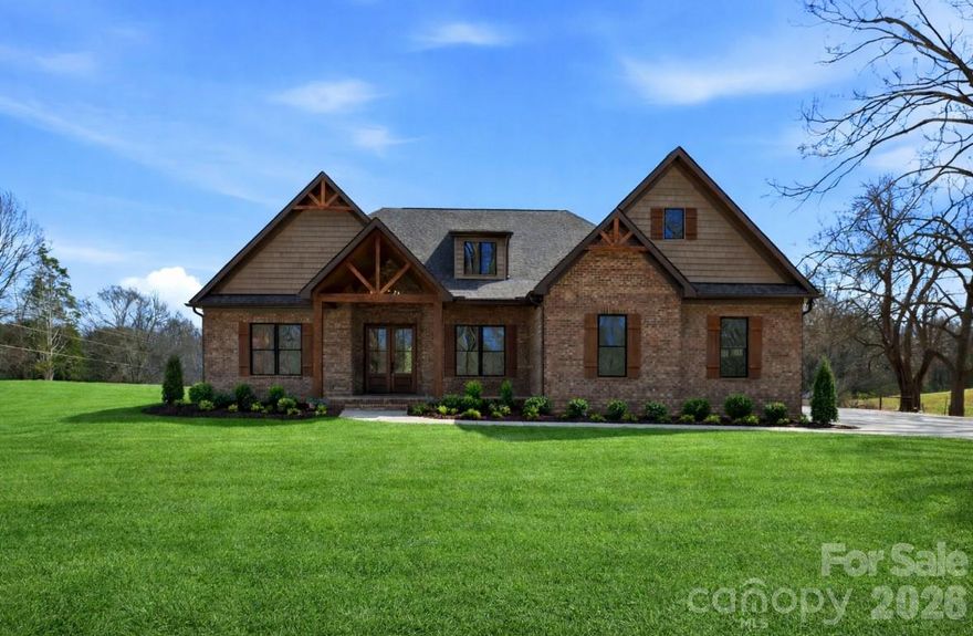 Introducing “The Willow” – a premier home in the Summit Signature Collection by Summit Building Group. This thoughtfully designed home features elevated craftsmanship and beautiful finishes throughout. The striking vaulted front porch with stamped concrete and wood-paneled ceiling creates inviting curb appeal and continues inside with matching wood accents in the foyer. A private home office with French doors sits off the entry, while the family room opens to the outdoors through 8’ sliding glass doors overlooking the backyard and covered rear porch with solid wood posts.

The gourmet kitchen includes a double oven, farmhouse sink, custom vent hood, pot filler, stainless refrigerator, beautiful quartz countertops, and a thoughtfully selected tile backsplash. Durable LVP flooring runs throughout the home for style and continuity.

The primary suite features a spa-inspired bath with custom tile, oversized frameless shower, shiplap vanities, and quartz countertops. The custom primary closet connects directly to the laundry/mud room with sink, wood shelving, drop zone, and additional storage space. 8-foot interior and exterior doors, thoughtfully selected lighting fixtures, and quality finishes throughout complete this beautifully crafted home.

Situated on just over an acre of level, usable land, this property offers a peaceful countryside setting with no HOA and limited covenants and restrictions, providing flexibility for outdoor living, a future pool, storage building, or additional improvements. Enjoy the space and privacy of country living while remaining conveniently located near the growing amenities of Locust with easy access to Hwy 24/27 and Hwy 601, offering the perfect balance of tranquility and accessibility.