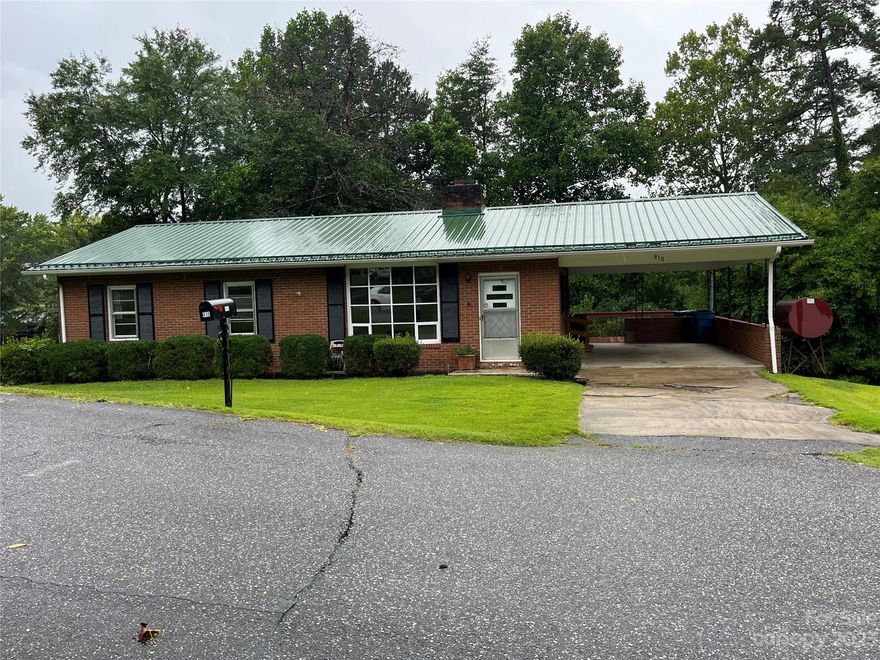 Charming brick House in a great location. Lots of potential with this 3 bedroom, 1.5 bath home. Quiet neighborhood with well-manicured yard. All bedrooms and bathrooms on the main level. Full unfinished Basement. Covered car port and nice back deck to relax.  Convenient located to Interstate 40 and downtown Valdese.