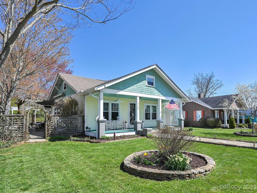 Downtown Weaverville at its finest! Immaculately maintained, this stunning, spacious 2,309 sqft 3BD/2BA one-level craftsman home features many renovations/upgrades including solar panels, tankless water heater, heated indoor pool, gas logs, sunroom with skylights and totally remodeled kitchen and bathrooms. Large open kitchen features quartz countertops, shaker cabinets, farmhouse sink, subway tile backsplash, breakfast bar and cozy bench seat area for relaxing. 10’ ceilings, original hardwood floors throughout main living area, and surround sound system in living room with speakers throughout the home, pool room and kitchen courtyard. Level corner lot with fenced in backyard, and award-winning landscaping with plenty of outdoor living areas to enjoy. Pergola over kitchen courtyard; both stone patios have retractable Sunsetter awnings. Park in the detached 1-car garage or under the 2-car carport. Detached storage building with potential for living space, studio or workspace.