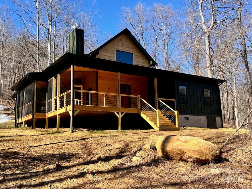 ***UNDER CONSTRUCTION***Designed for permanent or second home living, this 1650 sq. ft. home with 650+/- sq. ft. of covered porches. Touches of stonework, horizontal & vertical wood siding, barn wood shutters, cedar shakes and metal roof accents is under construction and ready for interior selections to be made. This home by Moss Creek – renowned for luxury rustic home & cabin design –reflects the natural beauty of the setting. The open floor plan features window placement to capture the beauty of the NC Mountains and a kitchen that is open to a comfortable living area that flows to outdoor relaxing or entertaining while gazing at the mountain views. Convenient to the Blue Ridge Parkway, Boone, Hiking, and many additional mountain attractions. Linville Falls Mountain Club offers all underground services including sewer, water, power, and high-speed cable.
