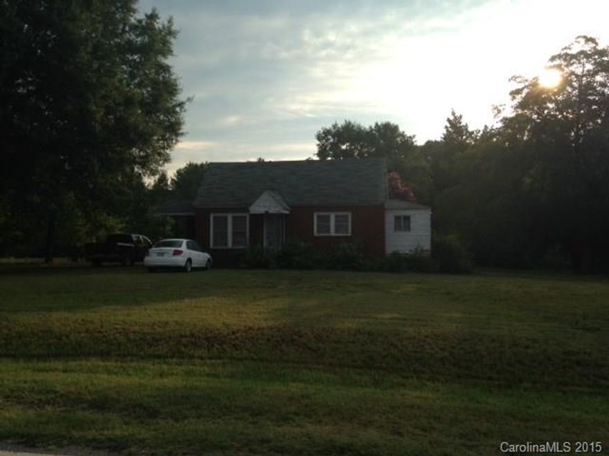 ***Multiple offers received and contract has been accepted just waiting on signatures***Great location and over 3 acres to roam with this cute brick bungalow.  Needs some TLC, but has central air, oil heat, newer well and newer drainfield in septic system.  Wood floors under carpets in living room and bedrooms.   Located in the Mooresville School District optional overlay area so could opt in to city school district.