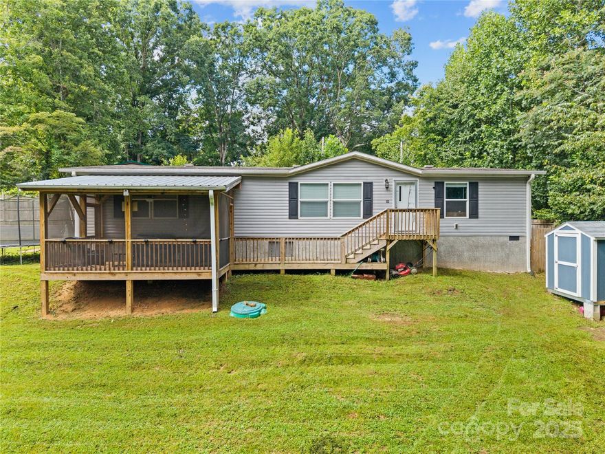 Bright 3BD | 2BA | Open Plan + Outdoor Comfort
Step into this light-filled, open-layout home with a chef’s-style kitchen featuring an oversized island, breakfast bar, and pantry. The thoughtfully split-bedroom layout includes a serene primary suite with expansive windows and a spa-like bathroom with dual sinks and a walk-in shower. The guest bath also offers dual vanities and a tub/shower combo.

Enjoy indoor-outdoor living with a spacious living and dining area flowing to a screened front deck and a backyard firepit—perfect for casual summer evenings. Two versatile outbuildings provide extra storage or hobby space, and the generous parking area adds convenience. Equipped with a newer heat pump and central air, this home blends comfort with functionality.

Don’t miss this well-appointed retreat—schedule your private tour today