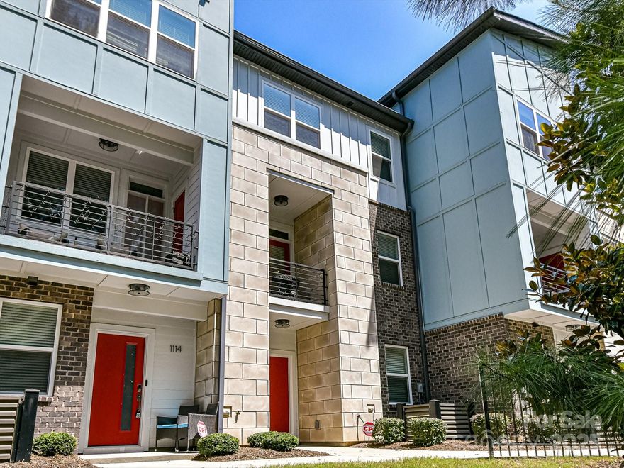 This 3-story townhome in heart of NoDa is turnkey and ready for you to call it home! Better than new! 9 foot ceilings throughout. The second floor (main level) features 5" wood flooring, quartz countertops, premium painted 42" light gray cabinetry, a 30-inch gas cooktop & chimney hood, a cozy living area, powder room, and a terrace overlooked the wooded common space! Upstairs are the primary and guest bedrooms, as well as the laundry room.  Each bedroom has an ensuite bath with tile flooring & walk-in-closet. The primary bath features double sinks with quartz countertops w/plenty of storage, and a tiled walk-in shower.  You'll find a spacious 2-car garage, comfy den area, another powder room, and a storage closet all on the first floor!  Enjoy all the walkable lifestyle this community offers! Light rail too! Easy access to Uptown, CLT airport, South End, and Southpark. Make this incredible townhome yours today!