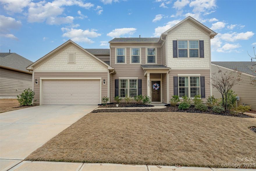 Like new with tons of luxury finishes!  This stunning 2021, 2 story home will exceed your expectations! As you enter the home you will notice the beautiful hardwood floors that flow throughout the downstairs, and upgraded luxury lighting in every room. The Gourmet kitchen will impress your guests, with a wood accent built in exhaust hood, 5 burner gas stovetop, wall oven/microwave combo, and a beverage / wine center for hosting.  The timeless white quartz countertops, and a lighter brick backsplash tie it all in together. The kitchen opens directly to the breakfast and living area with a granite surround gas fireplace and plenty of natural light. Upstairs you will find a spacious primary suite with a bath that includes a fully tiled shower, tiled floor, and quartz countertops. A spacious loft, 3 additional bedrooms and an additional upgraded bathroom complete the upstairs. The garage is a tandem 3 car garage. Out back, there is a covered patio that is perfect for entertaining.