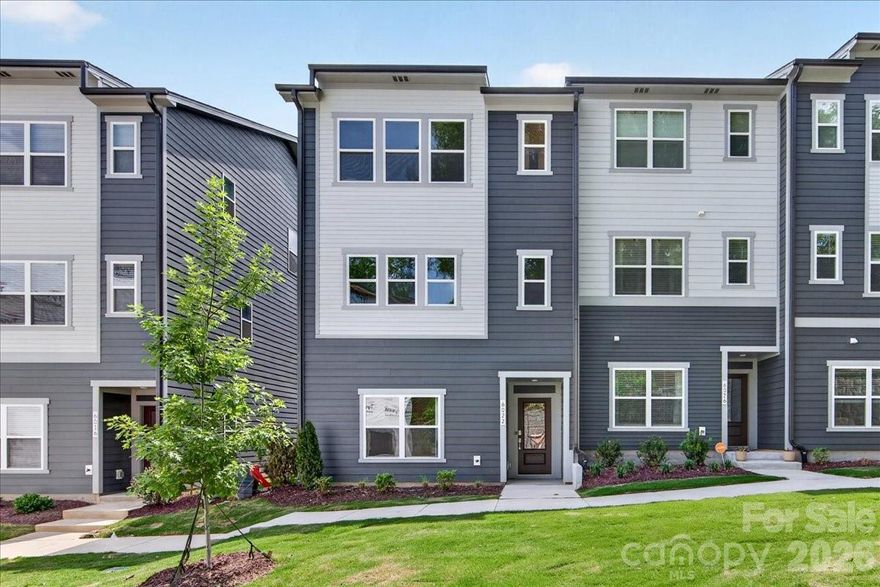 Welcome to 6022 Pivot Ct, a stunning 4-bedroom, 3.5-bathroom home in the sought-after Context at Oakhurst community in Charlotte, NC. Tucked into the back of the community for added privacy, this three-story home features a first-floor bedroom suite with a full bathroom and tiled walk-in shower, ideal for guests or multi-generational living. Elegant oak box stairs with open rails and vertical metal black balusters lead to the second floor, where a gourmet kitchen showcases GE Profile™ Advantium® wall oven technology, a GE 36" direct vent chimney hood, Winstead Maple Sarsaparilla dark brown cabinetry, white quartz countertops, a GE® counter-depth side-by-side refrigerator, and a large single-bowl stainless steel sink , all opening to a private outdoor living space perfect for entertaining. Upstairs, the primary suite offers a tiled walk-in shower, a secondary bathroom features tiled walls above the tub, and an ENERGY STAR®-rated GE® front-load washer and dryer add everyday convenience. Located minutes from Uptown Charlotte, Plaza Midwood, Cotswold, Wendover, and Elizabeth, Context at Oakhurst puts premier Charlotte dining, culture, and city living within easy reach. Photography is the Wright plan Model Home