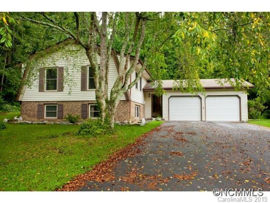 Spacious 4BR/3BA split level home on level private lot. Quiet neighborhood off Asheville Hwy w/easy access to Hendersonville, Fletcher or Asheville. LL suite & large Family Room along w/large unfinished space & laundry. Upper level has Master Suite & 2 other BRs, hall bathroom, plus bright Kitchen & large flex space that can be Living Room, Dining Room or a little of both. Very energy efficient w/terrific large screened porch on back of home.