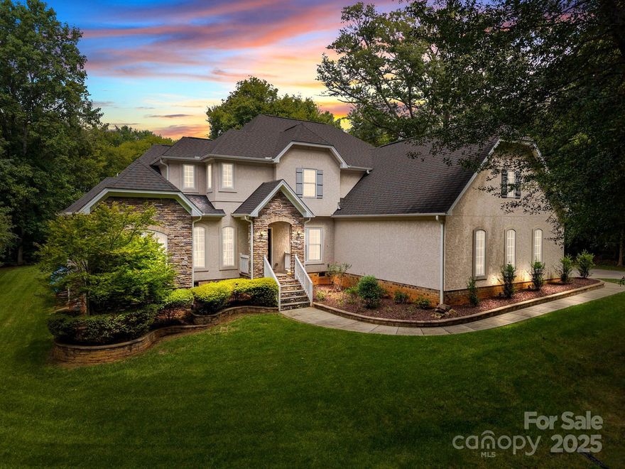 Welcome to this stunning home set on a picturesque, park-like lot with nearly 2 acres of privacy. Inside, you’ll find an open floor plan with the primary suite conveniently located on the main level. The spacious kitchen flows seamlessly into the living room,  perfect for entertaining family and friends. Working from home is a breeze with a dedicated office space. Upstairs, you’ll discover three secondary bedrooms and a loft ideal for movie nights or gaming. Step outside onto the back deck that showcases gorgeous views of the large backyard. Whether you’re hosting a barbecue, enjoying quiet evenings, or gathering around the fire pit, this outdoor oasis has it all–including a hot tub for ultimate relaxation. With no HOA restrictions, you have the freedom to truly make this property your own. Conveniently located near Charlotte Douglas International Airport and the exciting, up-and-coming River District. Don’t miss your chance to own a piece of luxury living in a prime location!